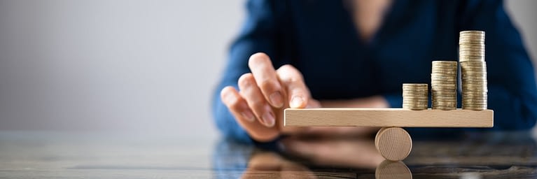 Balancing coins on mini seesaw